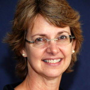 Headshot of Catherine F. Clarke against a dark blue background
