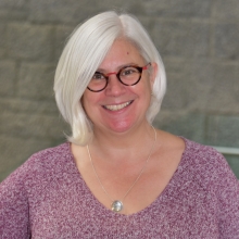 Heidi McBride wearing a dark pink sweater