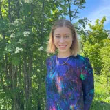 Lilli Ikonen standing amongst trees