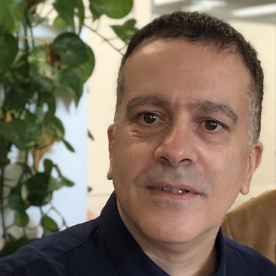 Headshot of Orian Shirihai wearing a dark shirt